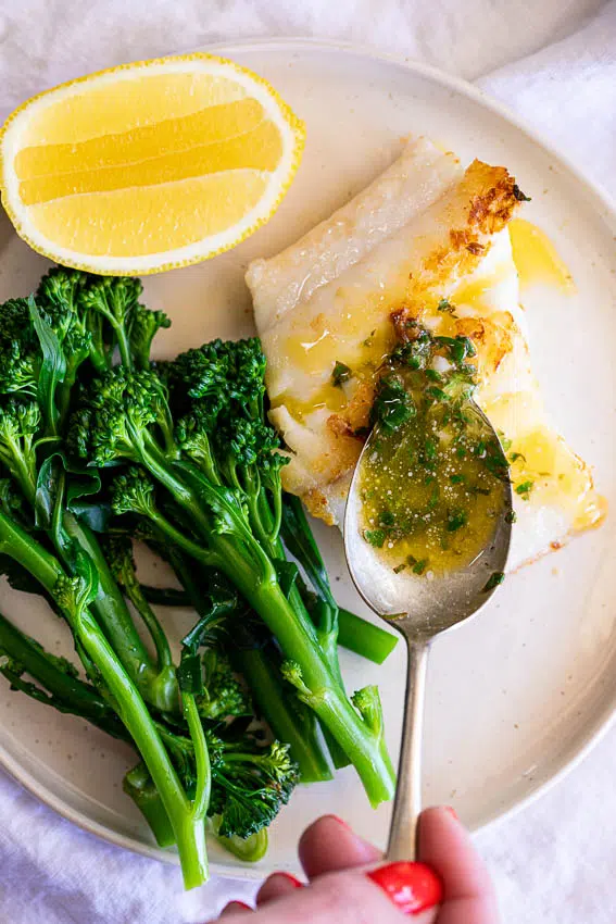 Easy Garlic Butter Sauce with fish and broccolini.