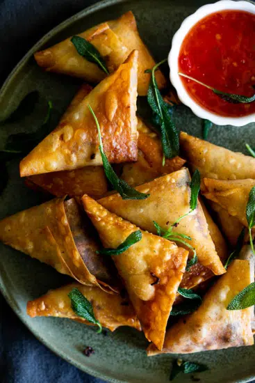 Leftover Turkey samosas with cranberry sauce and cheese.