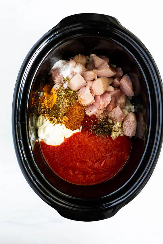 Butter chicken ingredients in a slow cooker/crockpot