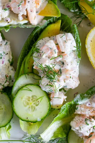 Healthy shrimp salad lettuce cups with cucumber and avocado.