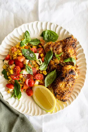 Easy Cajun Air Fryer Fish with corn salad.