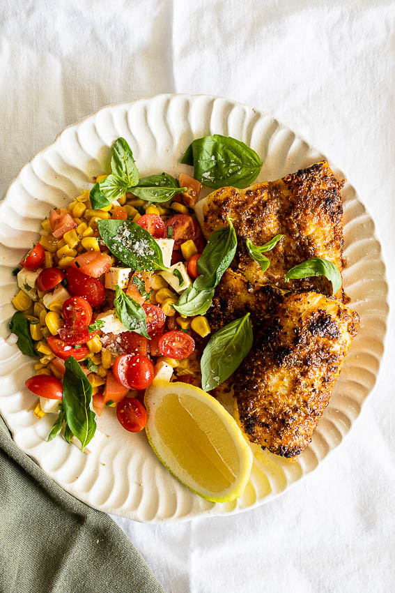 Easy Cajun Air Fryer Fish with corn salad.