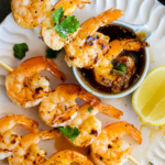 Grilled shrimp skewers with jalapeño cajun butter