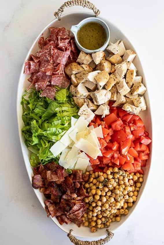Jennifer Aniston salad with lettuce, tomatoes, chickpeas, chicken, bacon and salami.
