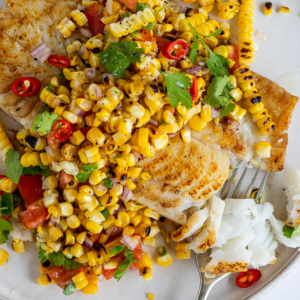 Seared fish with charred corn salad