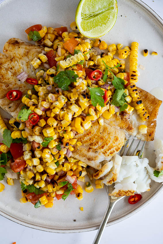 Seared fish with charred corn salad