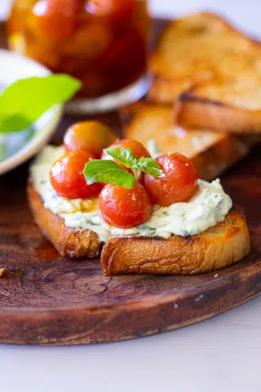 Marinated tomatoes with whipped ricotta on toast