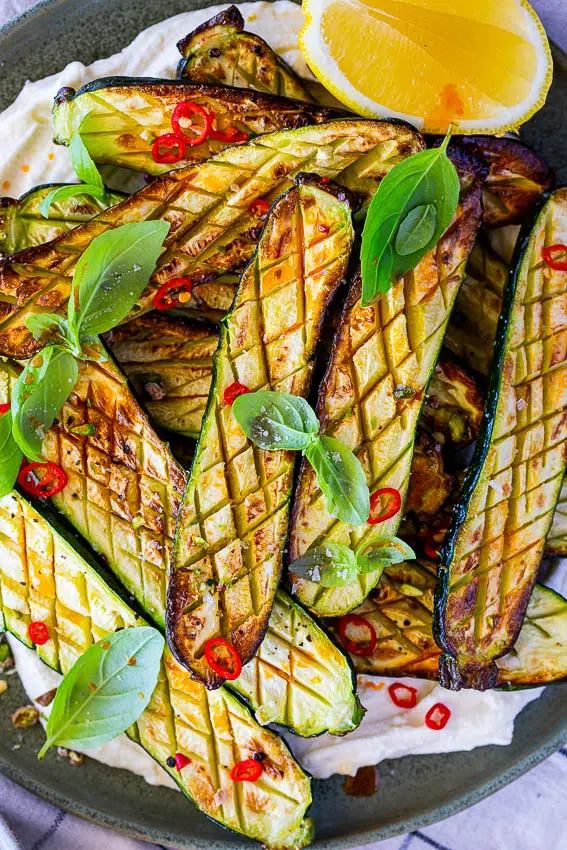 Air fryer zucchini on whipped feta cheese with fresh basil, lemon and chilli.