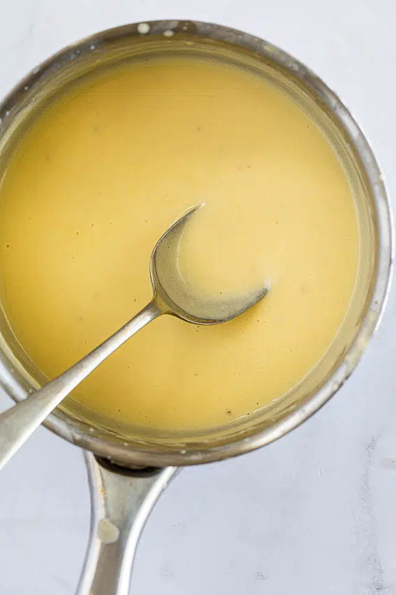 Lemon butter sauce in saucepan