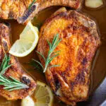 Pan fried pork chops with pan sauce.