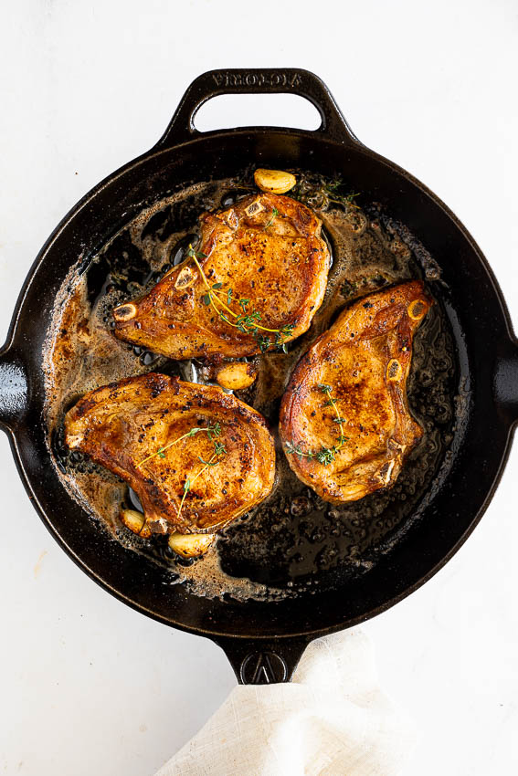 Pan Seared Pork Chops in cast iron skillet