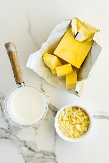Cream butter and garlic for mashed potatoes.