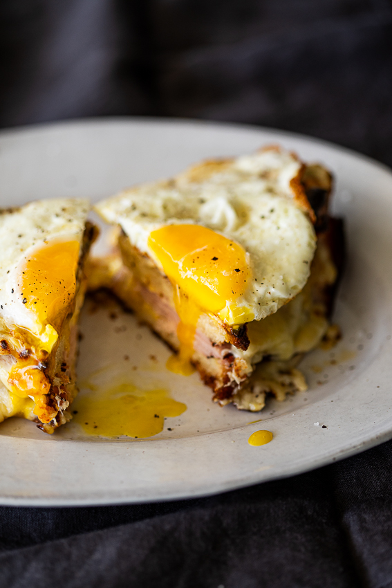 Croque Madame with soft fried egg on top.