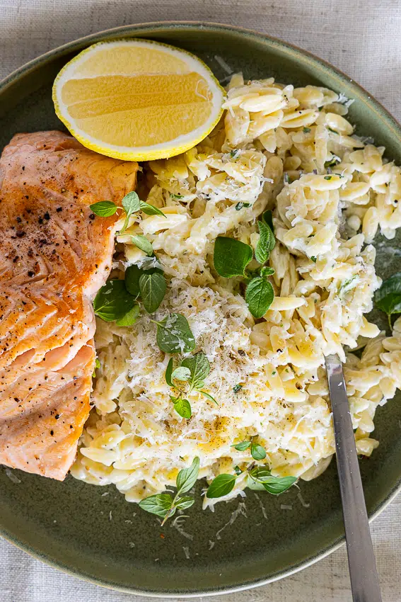 Creamy orzo with pan-seared salmon.