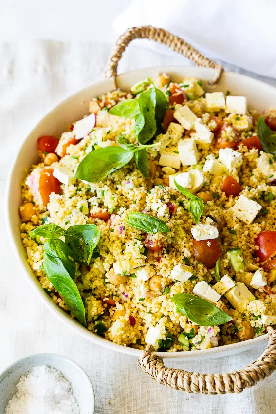Easy couscous salad with cucumber, tomato, feta cheese and herbs.
