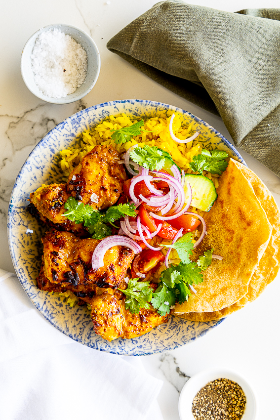 Air fryer tandoori chicken with curry rice and salad.