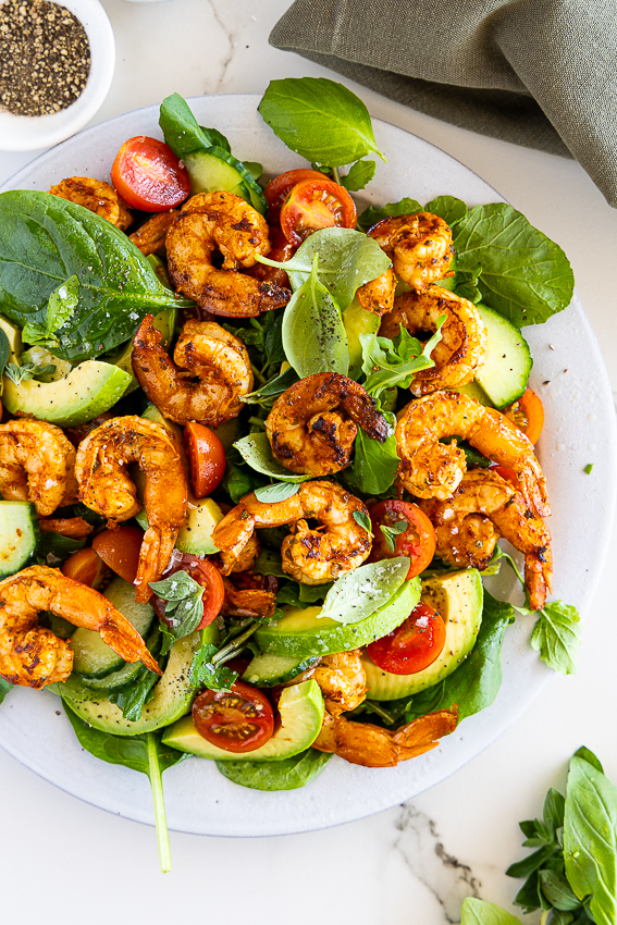 Grilled shrimp salad with avocado, tomatoes and cucumber