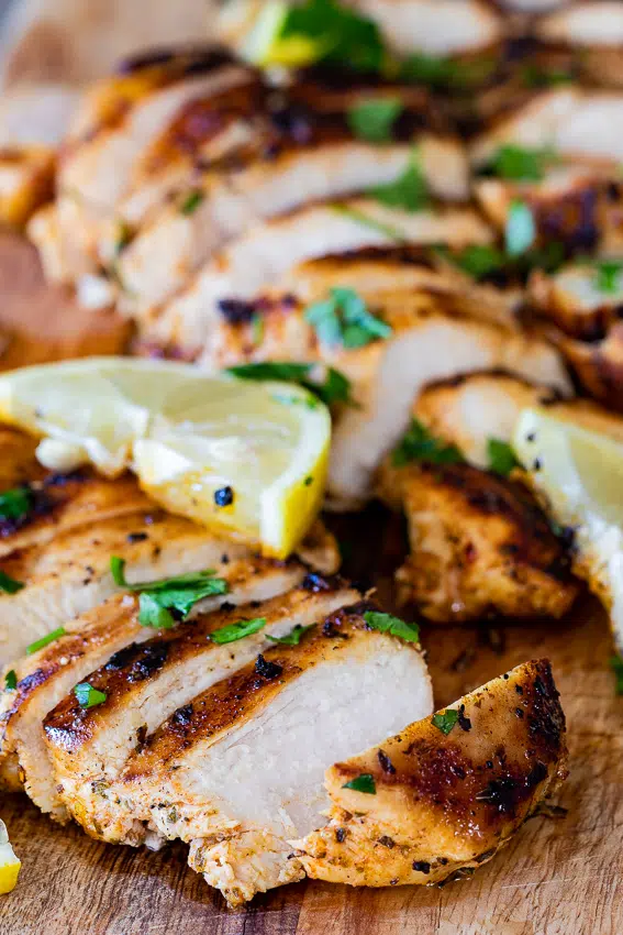 Sliced pan fried chicken breasts.