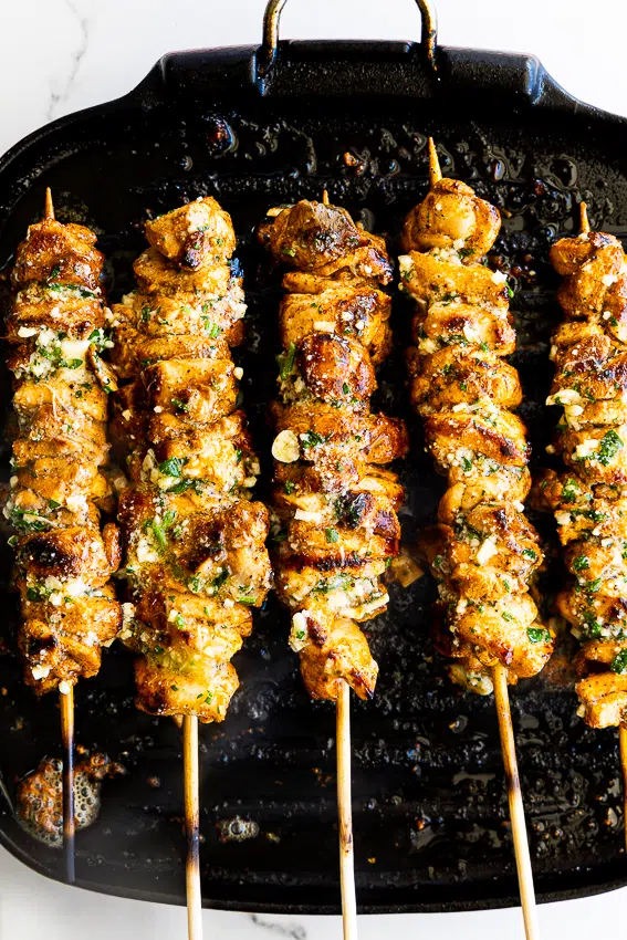 Garlic Parmesan chicken skewers in grill pan
