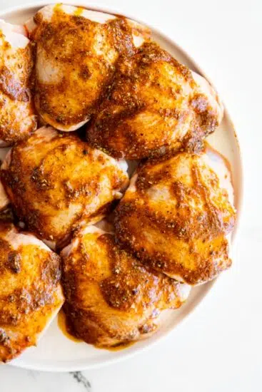 Chicken thighs with seasonings.