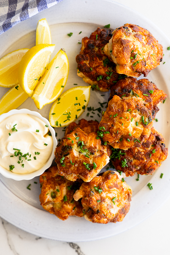 Salmon cakes served with lemon wedges and aioli for dipping