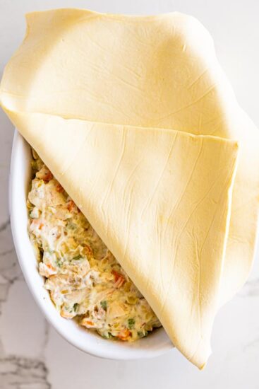 Puff pastry over pot pie filling.