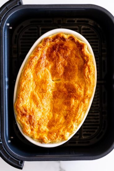 Cooked chicken pot pie in air fryer basket