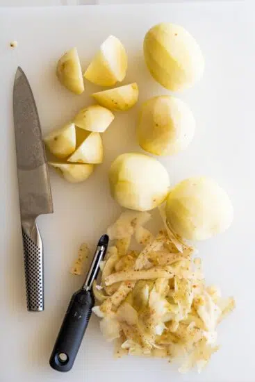 Potatoes peeled and chopped for roast potatoes.