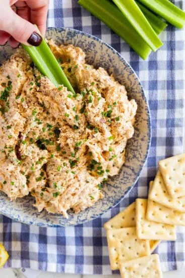Buffalo Chicken Salad served with crackers and celery.