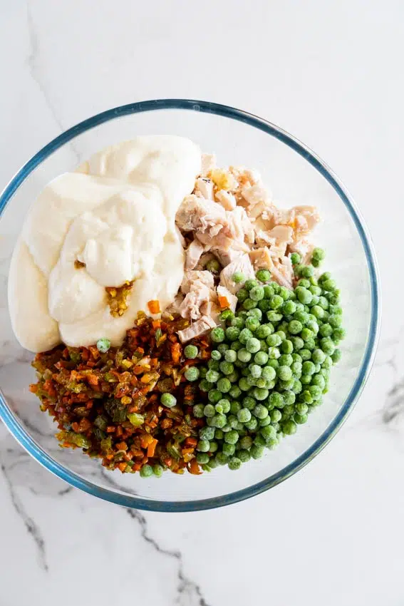 Chicken Pot Pie Casserole ingredients in a glass mixing bowl