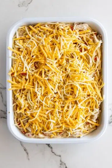 Easy Chicken Spaghetti topped with shredded cheese.