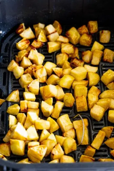 Cooked Apples in air fryer basket