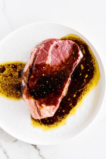 Sirloin steak with marinade poured over