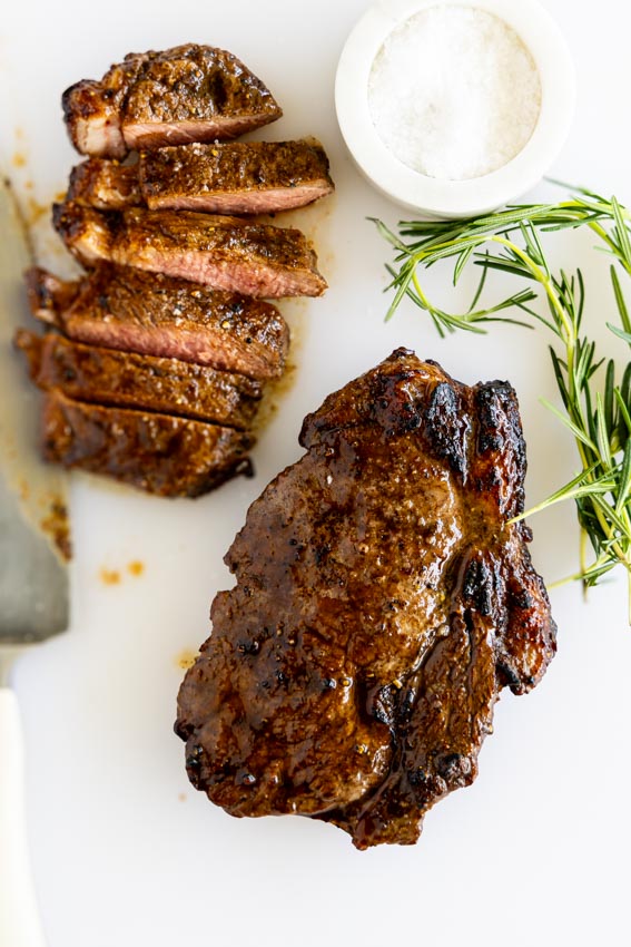 Air fryer steak on chopping board