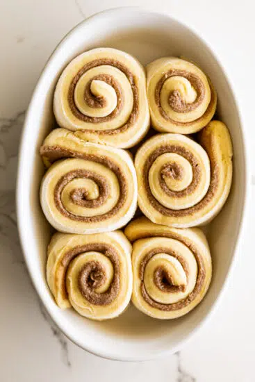 Cinnamon rolls in baking dish.