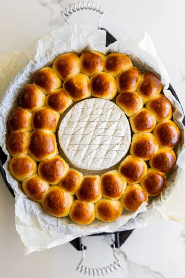 Baked bread rolls with brie cheese.