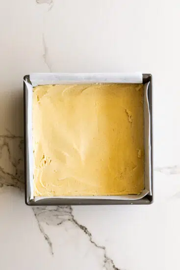 Shortbread dough in baking pan.