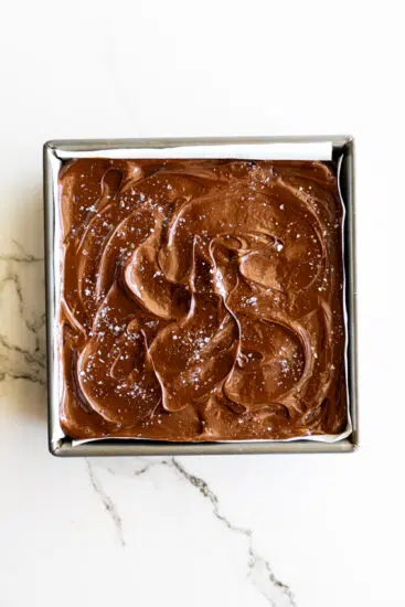 Melted chocolate poured onto millionaire's shortbread