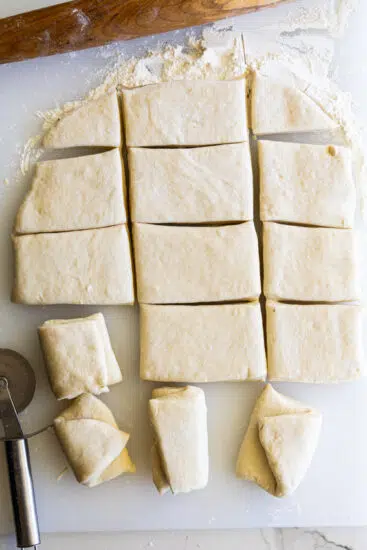 Parker house roll dough cut into squares
