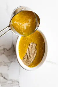 Melted butter poured onto Creamy Chicken Liver Pâté