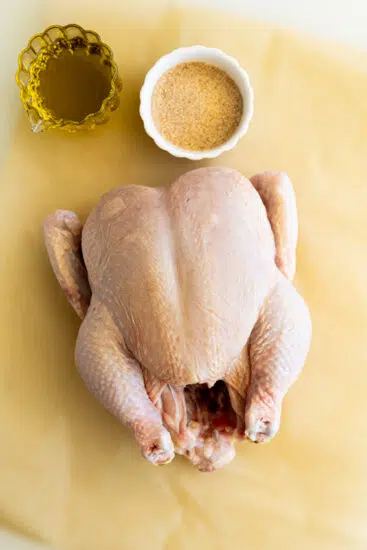 Rotisserie chicken cooked in the air fryer with oil and seasoning.