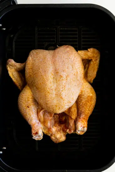 Chicken cooked breast-side up in air fryer.