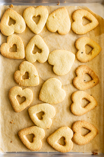 Valentine's cookie hearts on baking sheet.