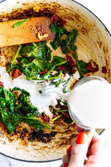 Heavy cream poured into pan.