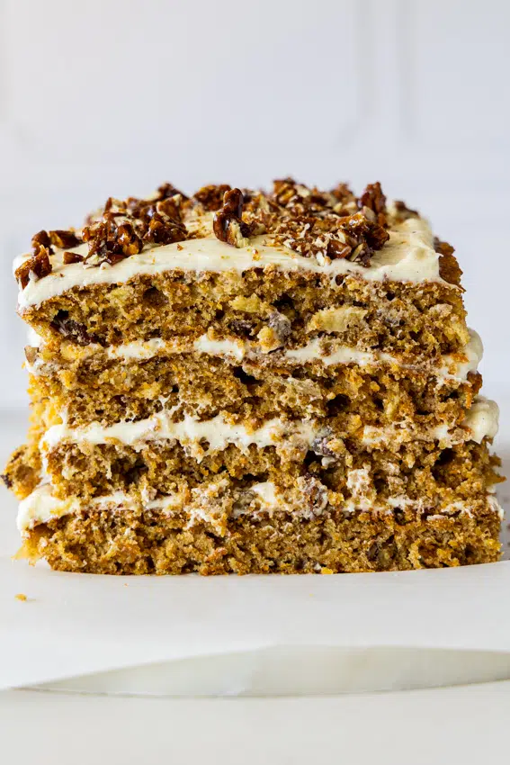The best carrot cake layered with vanilla bean cream cheese frosting topped with pecan praline.
