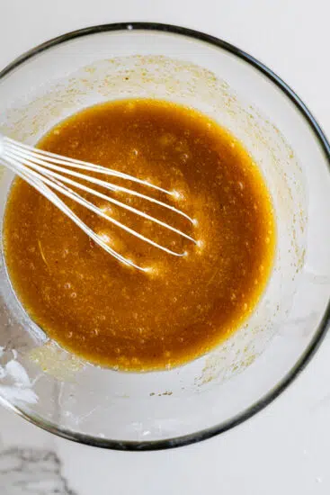 Wet ingredients for carrot cake whisked together.