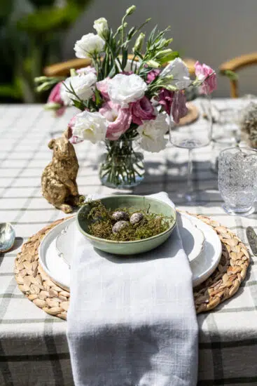 Easter table setting with nests and eggs.