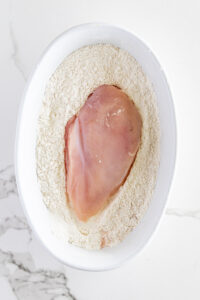 Chicken breasts coated in seasoned flour
