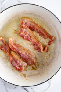 Bacon frying in pan.