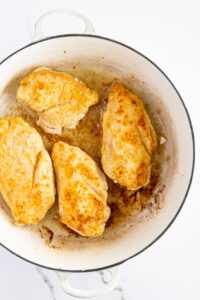 Chicken breasts seared in bacon fat.